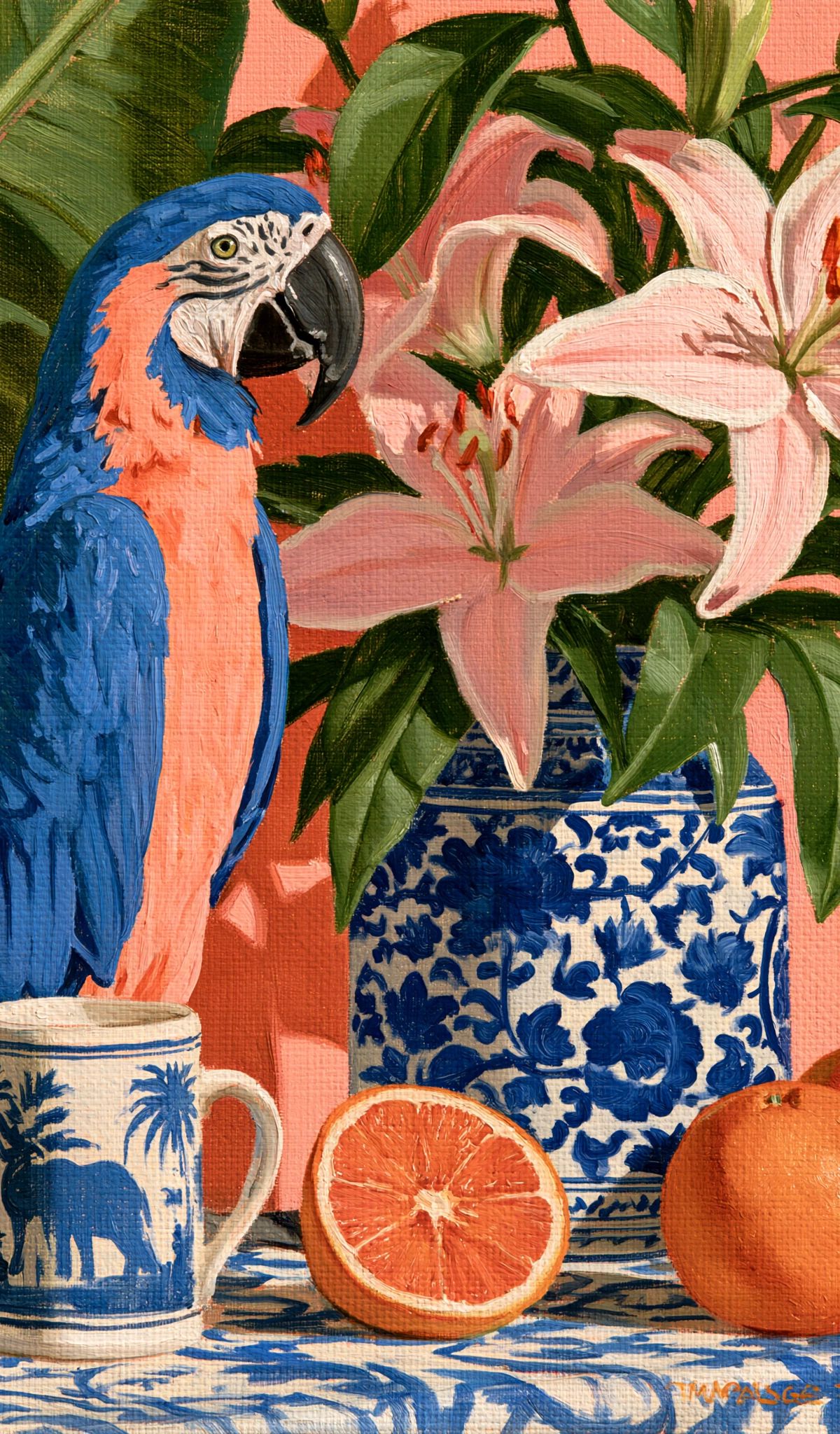 A blue and red macaw sitting next to a blue and white porcelain vase holding pink lilies, with oranges and a decorative mug on a patterned surface against a coral background